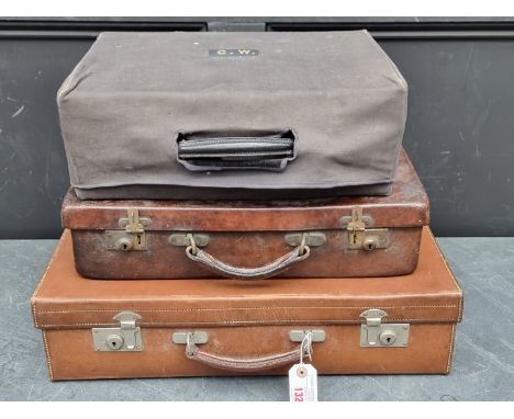A vintage&nbsp;Norfolk hide suitcase, 47cm wide; together with another tan leather suitcase, 55cm wide; and a blue leather to
