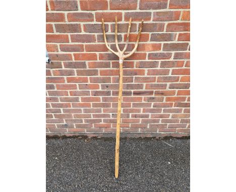 A vintage beech hayfork,&nbsp;with branded initials, 143cm long. 