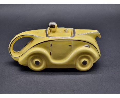 An Art Deco style Sadler pottery novelty racing car teapot and cover. 