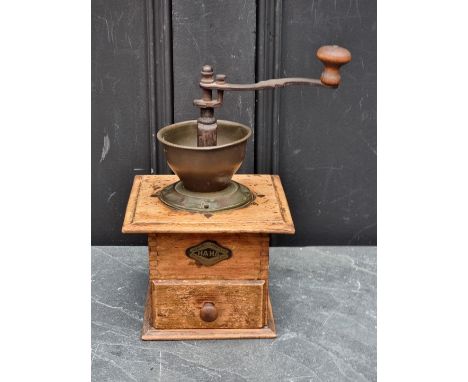 A vintage coffee grinder. 