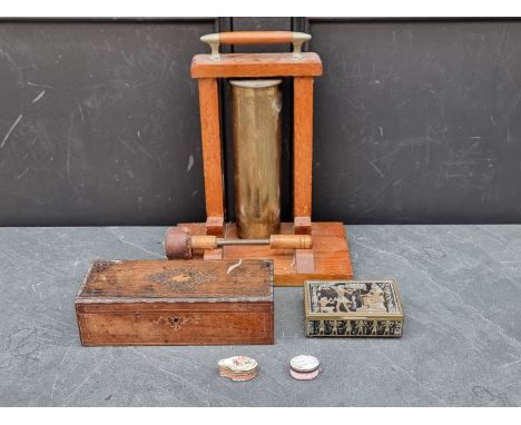 An oak and brass table gong,&nbsp;37cm high; together with a 19th century rosewood and inlaid glove box; a brass musical cask