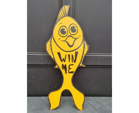 A vintage&nbsp;plywood&nbsp;'Win Me' novelty goldfish sign,&nbsp;98 x 41cm. 