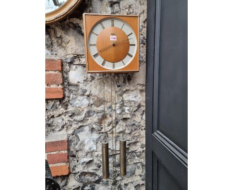 A 1950s Kienzle wall clock,&nbsp;28.5cm wide, with weights and pendulum. 