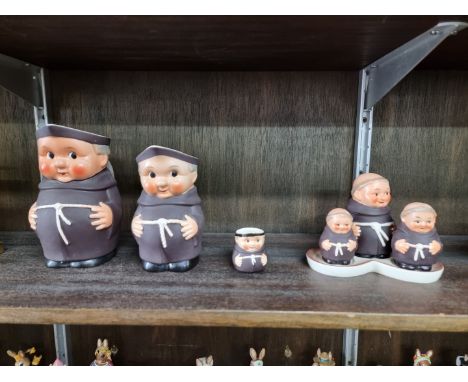 A Goebel novelty monk cruet set;&nbsp;together with three similar jugs, largest 16cm high. 