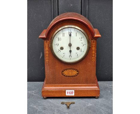 An Edwardian mahogany and inlaid mantel clock,&nbsp;31.5cm high, with pendulum. 