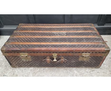 A late 19th/early 20th century Moynat 'Damier' trunk,&nbsp;labelled to the interior, 34cm high x 110.5cm wide x 57cm deep. 