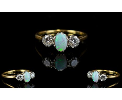 18ct Gold - Superb Quality Opal and Diamond Dress Ring. The Fine Opal Flanked by Two Good Quality Diamonds of Good Colour and