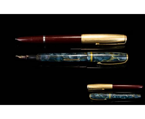 Two Vintage Pens The first a 1940's Parker with gilt top and branded clip, the body of claret resin. The second marked Burnha