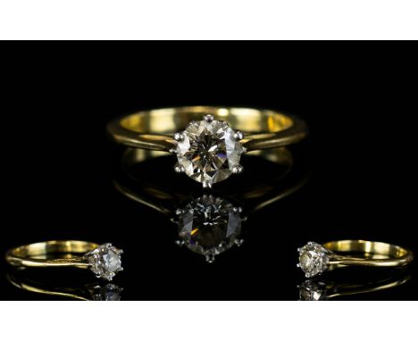 18ct Gold Single Stone Set Diamond Ring. The Round Brilliant Cut Diamond of Good Cut and Shape. Diamond Weight 1.01 cts. Colo