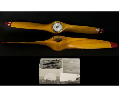 Two 44 Inch Wooden Propellers One Mounted With Barometer Each with markings, 'US Propellers Inc SER 22048 BK 747' along with 