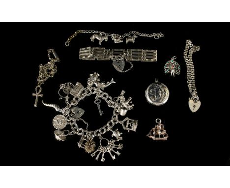 A Vintage Silver Charm Bracelet Loaded with 16 Good Charms. All Marked Silver, 50.5 grams + A Small Amount of Hallmarked Silv
