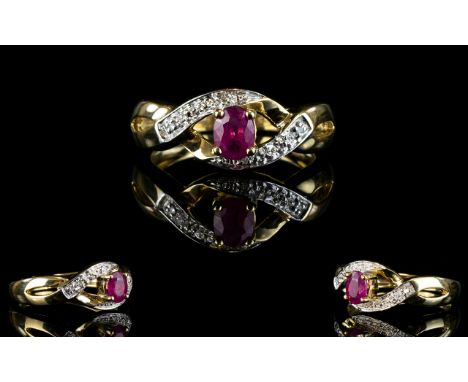 Ladies 9ct Gold Ruby And Diamond Set Dress Ring. The Ruby is of excellent colour. Est weight of Ruby 0.30pts. As new conditio