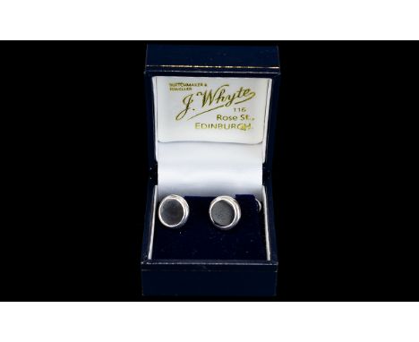 Silver Pair of Onyx Cufflinks, boxed cufflinks of circular form set with black onyx