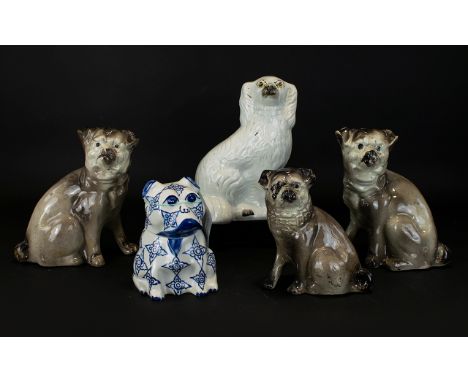 A Collection of Five Ceramic Pug Figures, One blue and white pattern trinket pot with removable head, one Staffordshire white