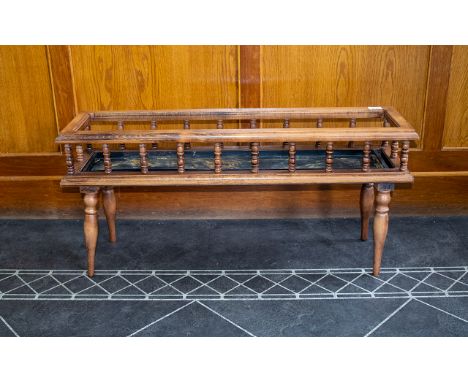 Wooden Plant Trough with spindle gallery, turned supports and inset with metal tray. Length 36 inches.
