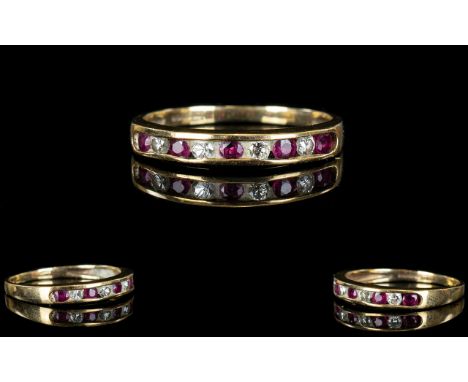 9ct Gold - Attractive Ruby and Diamond Set Dress Ring. Fully Hallmarked. Both Rubies and Diamonds of Good Colour. Ring Size -