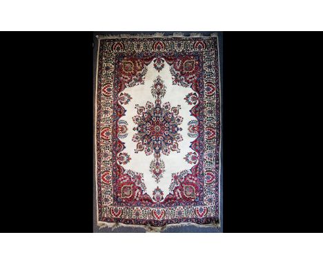 A Large Persian Carpet Very large heavyweight woven wool rug in traditional floral and foliate design with wide borders and c
