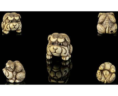 Japanese Superb Quality 19th Century Signed Carved Ivory Netsuke in the form of a dog figure in a sitting position. Signed to