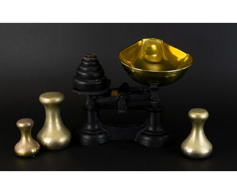 Traditional Brass Kitchen Scales Comprising three large weights, along with cast iron weights,black cast iron finish with tra