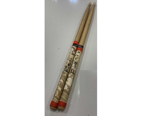 RENI SIGNED AND HEATON PARK USED DRUMSTICKS. A well used pair of 'Pro-Mark' drumsticks used by Reni of the Stone Roses during