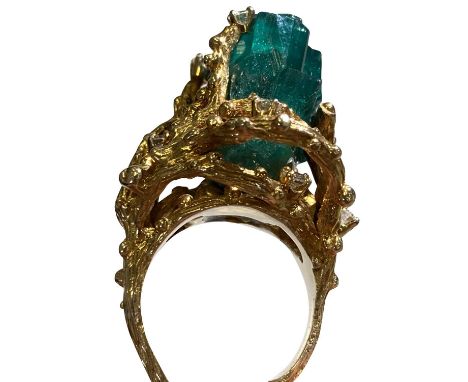 ELVIS PRESLEY GIFTED EMERALD RING. An extravagant and large emerald set in 14k gold, accented by diamonds (26g weight). The r