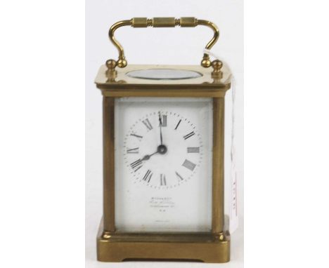 A reproduction French lacquered brass carriage clock, having visible platform escapement, twin barrel going eight-day movemen