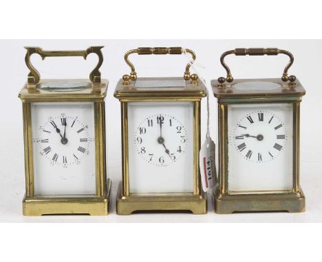 A French lacquered brass eight-day carriage clock, having visible platform escapement, h.12.5cm; together with two other simi