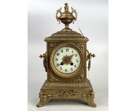 A late 19th century gilt brass (re-gilded) mantel clock having an unsigned white enamel Arabic dial, and French brass eight-d