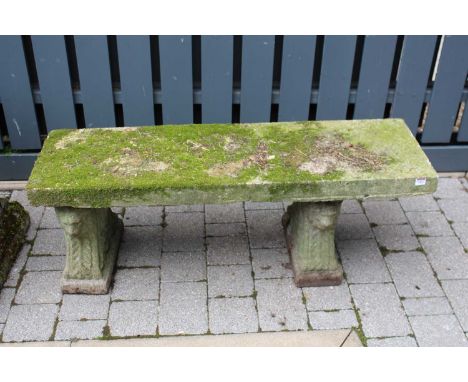 A concrete garden bench raised on twin pedestals, length 122cm