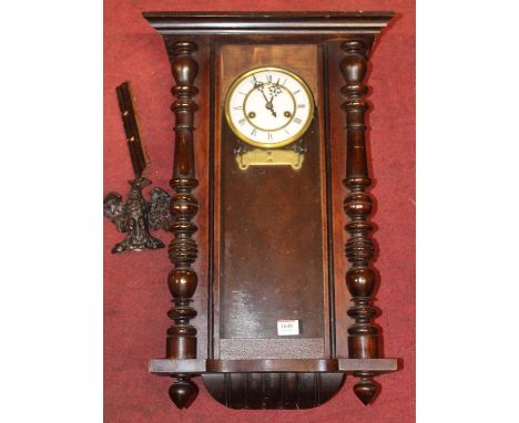 An early 20th century walnut cased Vienna drop trunk wall clock (incomplete), height 60cm
