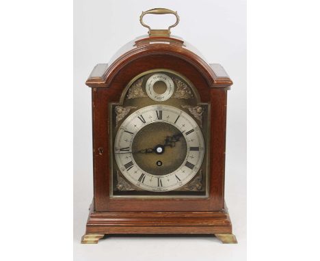 A Georgian style mahogany cased bracket clock having arched brass dial, height 34cm (handle down)