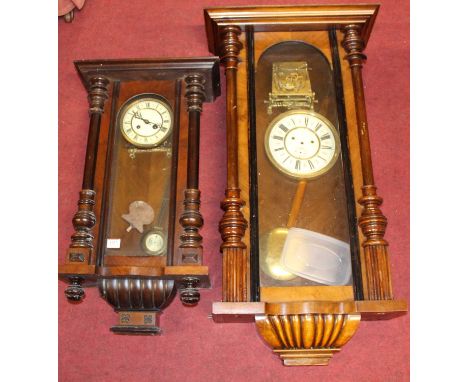 An early 20th century Vienna walnut cased drop trunk wall clock having spring driven movement striking on a gong, height 68cm