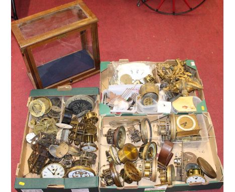 Three boxes of assorted clock parts, to include gilt metal figures, assorted cylindrical dials, movements, beam scale case et