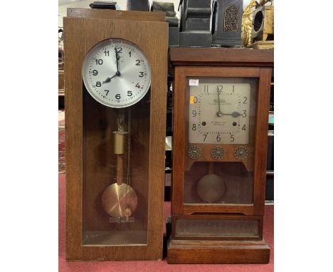 National Time Recorder Company Ltd clocking-in clock, being wall mounted height 73cm, together with one other oak wall mounte