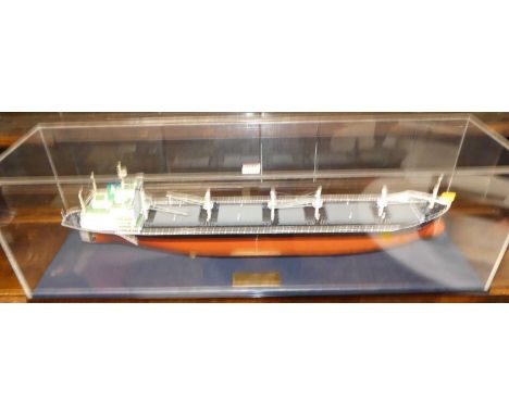 A scale model of the "MV Doma Hortencia II" housed in a perspex display case, with engraved brass label, case 102 x 31 x 26.5