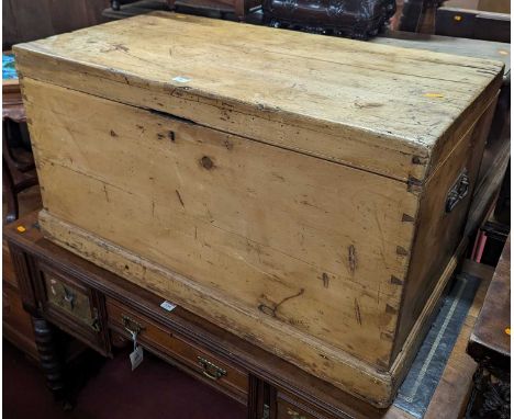 A Victorian pine hinge top tool chest with iron end carry handles, width 96.5cm