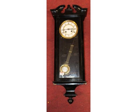 A circa 1900 Vienna ebonised drop trunk wall clock, 76cm