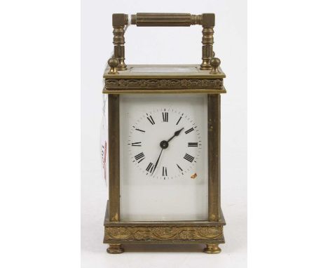 A late 19th century French lacquer brass carriage clock, the case with chased decoration, height 13cm