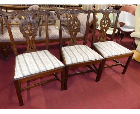 A set of three Chippendale style mahogany splatback dining chairs, each having striped upholstered needlework drop-in pad sea