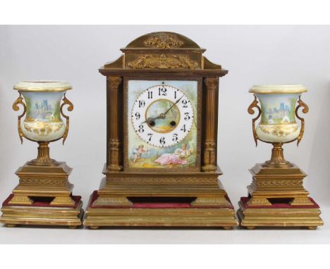 A circa 1900 gilt brass and porcelain three-piece clock garniture, the clock having French brass eight-day cylinder movement 