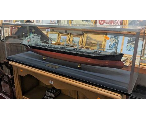 A scale model of the "MV Don Salvador III" housed in a perspex case, with engraved brass plaque, case dimensions 102 x 31 x 2