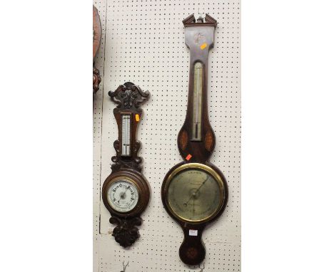 W. Adamos of Monmouth - a circa 1830 mahogany and inlaid two-dial wheel barometer, h.95cm; together with a circa 1900 carved 