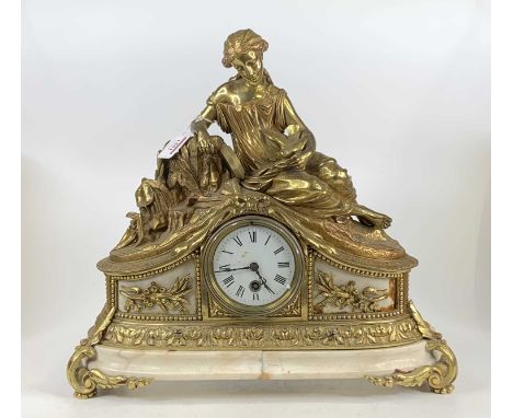 A French gilt brass and marble mantel clock, 20th century, the whole surmounted with a maiden and attendant dove, unsigned wh