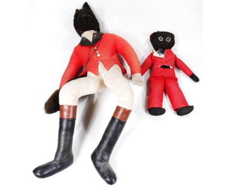 A 20thC comical soft toy, huntsman fox, dressed in hunting outfit with leather style boots and a further doll in red jacket a