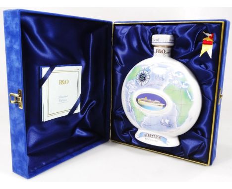 An XO Cognac P&amp;O Cruises Auora ceramic decanter with contents, in fitted box with paperwork, possibly Wade, 20cm high.