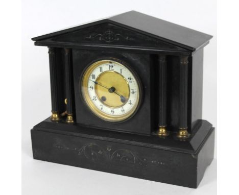 A Victorian black slate mantel clock, in architectural case, with fixed pedimented top, raised above a 11cm dia. dial flanked