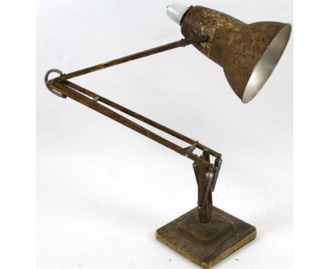 An early 20thC original industrial Bauhaus design angle poise lamp, with shaped shade, articulated stem and stepped square ba