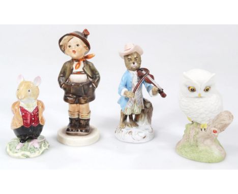 A porcelain figure, of a dog in flowing robes playing violin, polychrome decorated in blue, pink and green, ring handle cross
