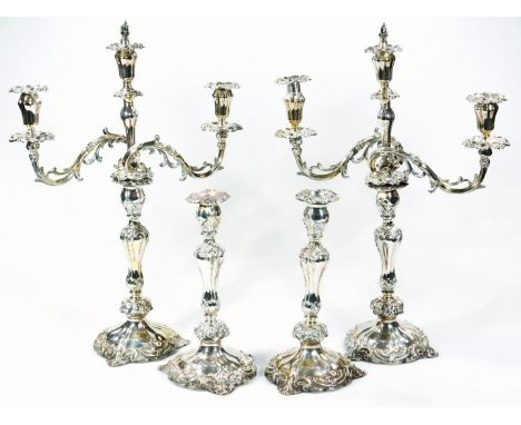 A set of four Victorian silver candlesticks, probably by Thomas James &amp; Nathaniel Creswick, of rococo design with acanthu