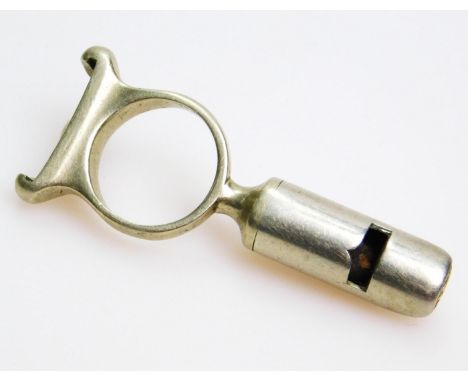 Shooting interest. A gamekeepers combination tool dog whistle and shotgun cartridge extractor. 6cm wide.